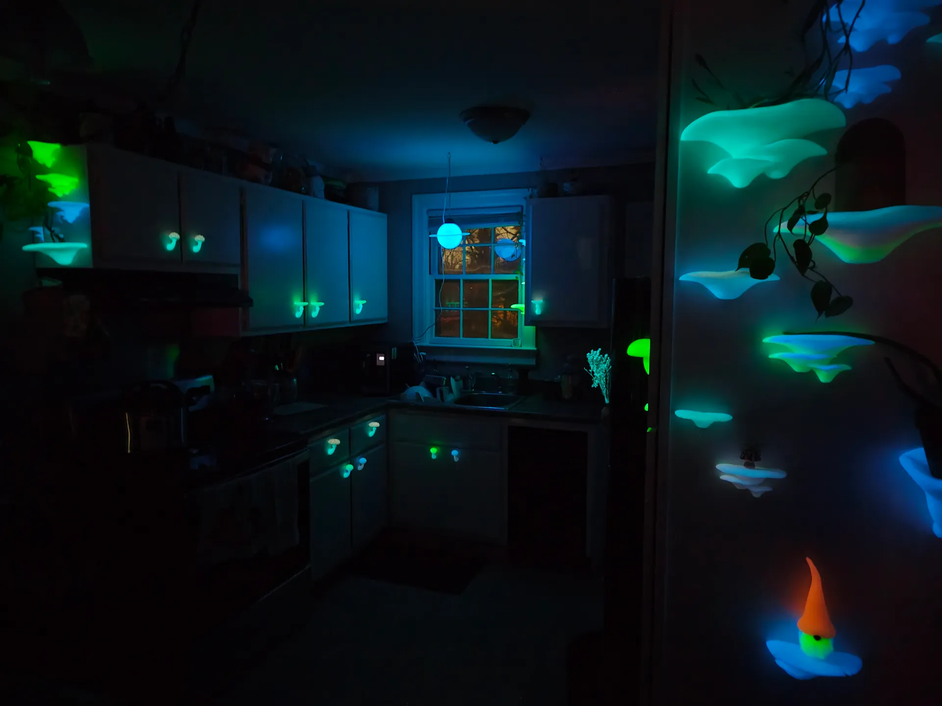 Glowing mushroom installation in a kitchen with blue and green bioluminescent lighting